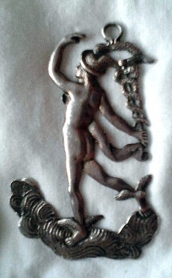 Deacon's collar jewel for Gihon Lodge, No. 49. Silver jewel in the form of Mercury/Hermes the Messenger God, riding on clouds and holding his winged staff. On the reverse is engraved text reading 'GIHON LODGE No. 49'.